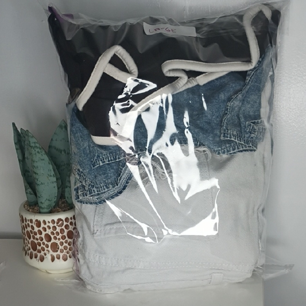 Mixed Stack of Folded Pants and Jeans - White, Purple, Light Blue, Black - Picture 13 of 14